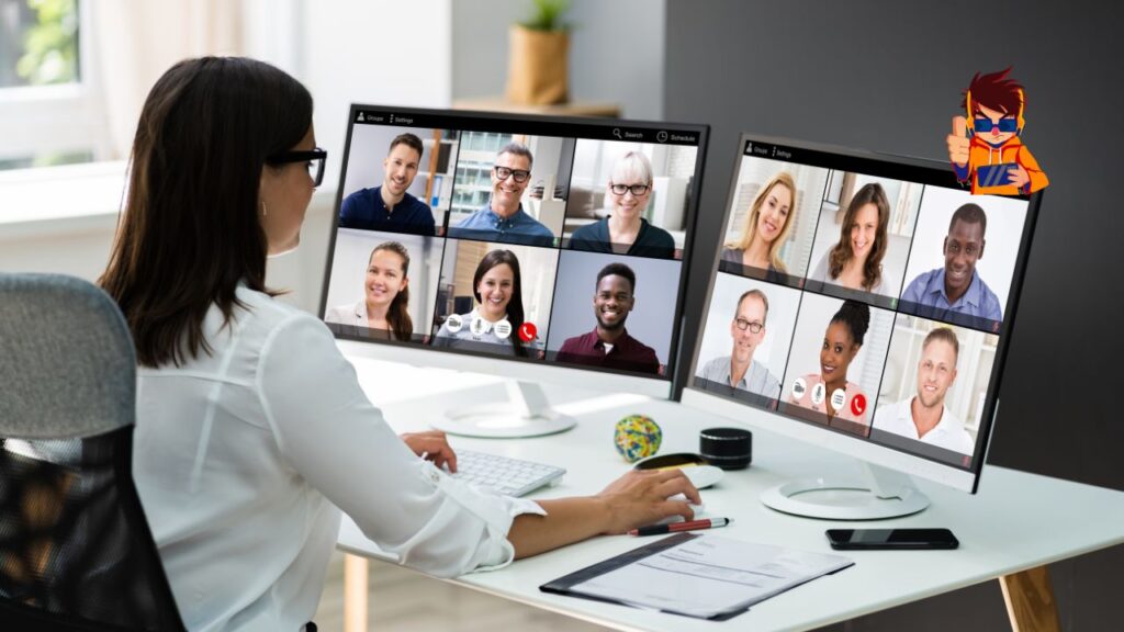 Woman participating in a virtual meeting using dual monitors displaying a video conference with multiple people